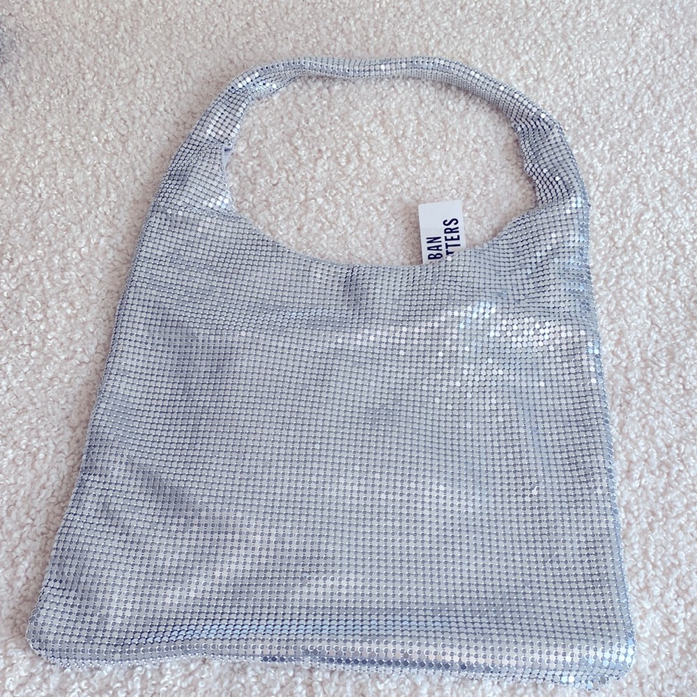 Urban Outfitters silver shiny bag.